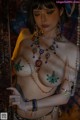 A woman in a belly dance costume posing for a picture.